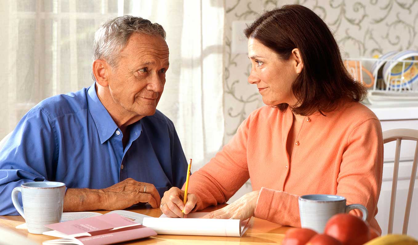 Man And Woman Discussing Home Mobility Solutions