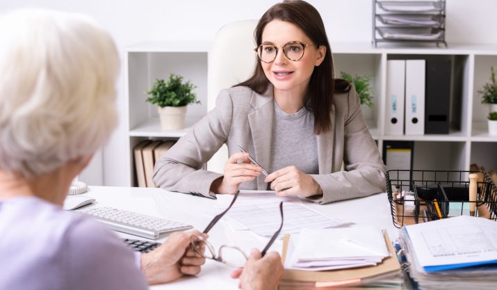 Social worker talking to senior lady